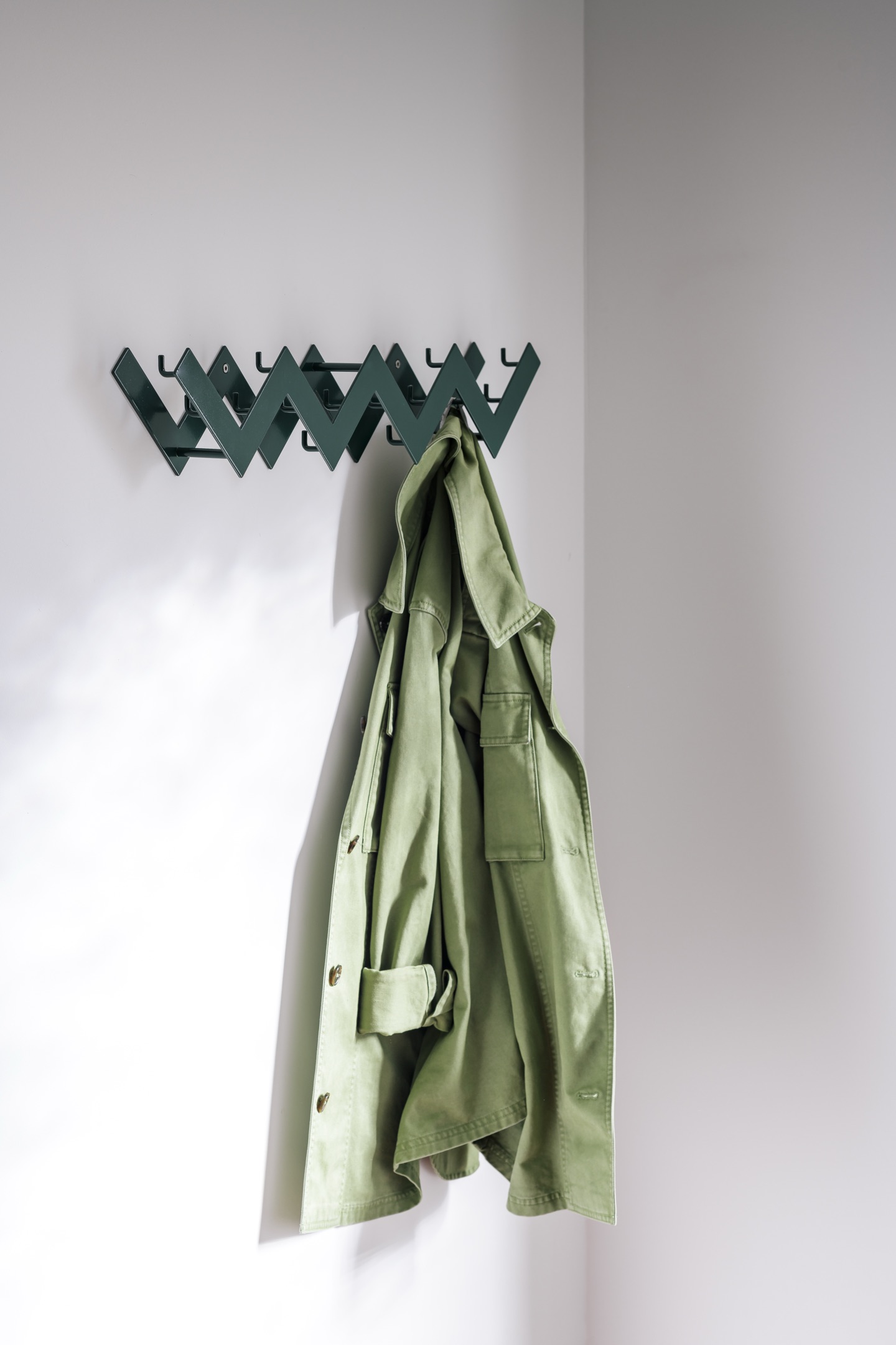 Ziggy wall-mounted coat rack by Axelle Vertommen in moss green